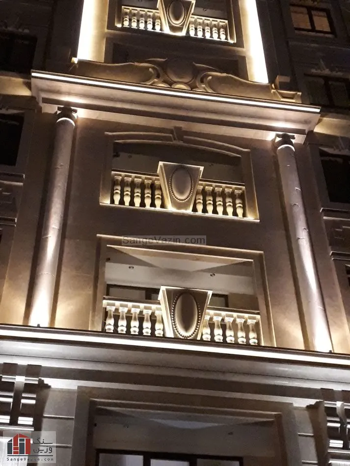 travertine in building facade at night with lightening